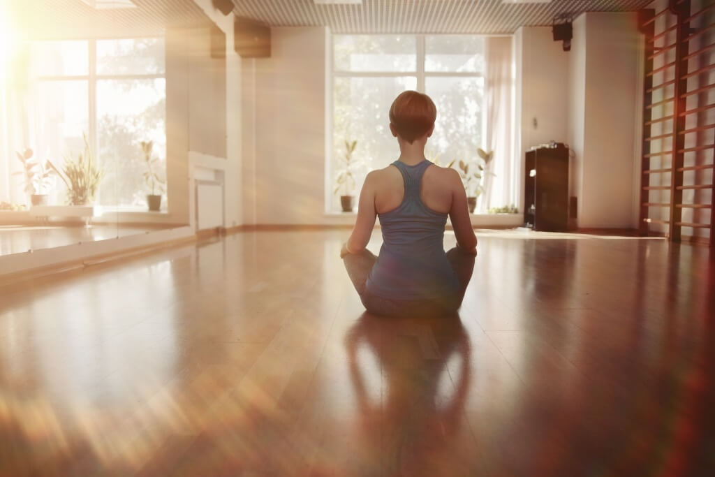 woman doing yoga in studio
