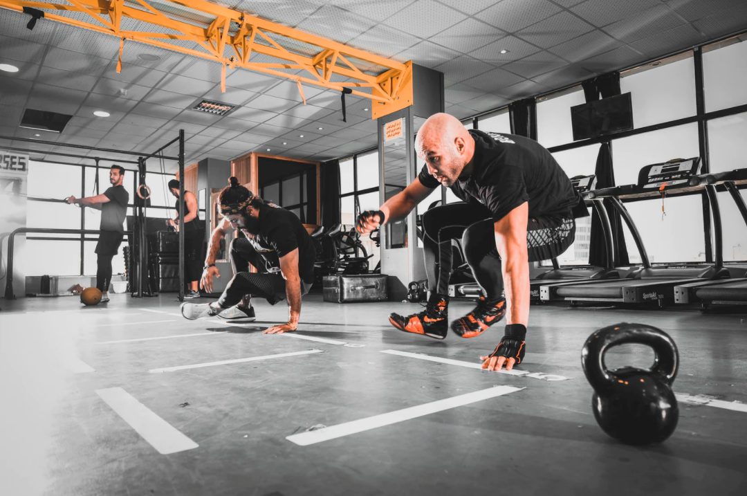 A group of people in a gymDescription automatically generated with low confidence